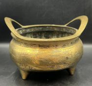 A 19th Century Chinese twin handled bronze censer D 23cm H 14cm