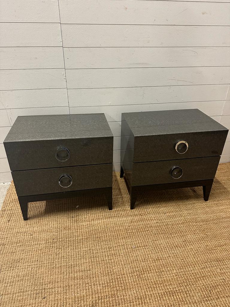 A pair of contemporary bedside table with chrome circular handles and soft closed drawers (57cm