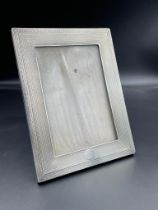 A silver picture frame, hallmarked for Birmingham 1923 by Henry Matthews