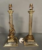 A pair of brass empire column table lamps