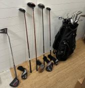 A set of golf clubs with accessories, various cubs and markers including Odyssey, Callaway Big