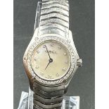 A Ladies Ebel Diamond bezel watched, boxed with papers.
