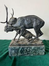 A bronze sculpture of a panther seizing a stag on a marble based, signed (H32cm W30cm)
