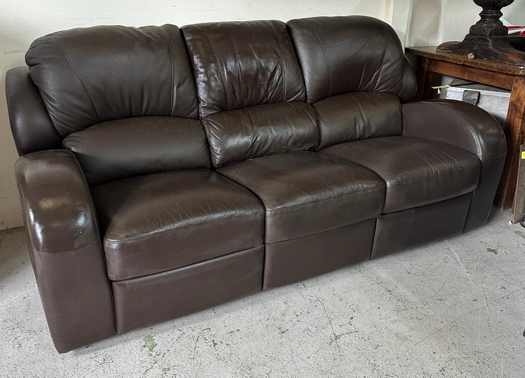 A brown leather three seater recliner sofa (H103cm D57cm W212cm)