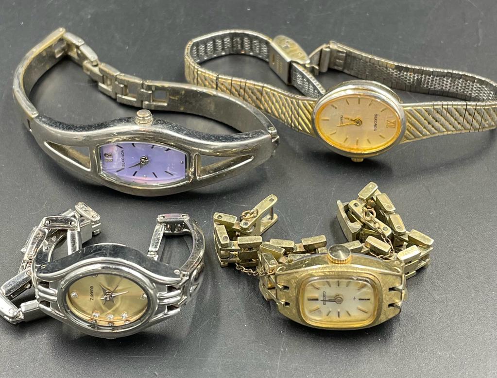 A selection of four vintage watches to include Seiko and Sekonda.