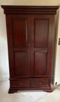 A two door hanging wardrobe or two shelf linen cupboard (H186cm W108cm D57cm)