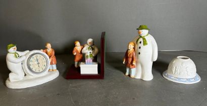 A selection of Coalport "The Snowman" collectables, a clock, bookend, moneybox and a tea light
