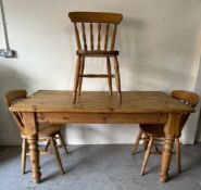 A pine kitchen table with four chairs (H78cm W152cm D88cm)