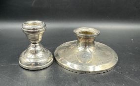 Two hallmarked silver squat candlesticks.