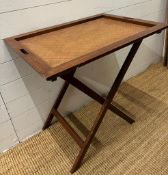 A folding butlers tray table