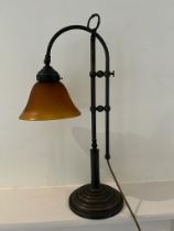 A French style table lamp with an iridescent glass shade