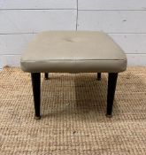A Mid Century grey upholstered button back foot stool on four black painted splayed legs (H28cm