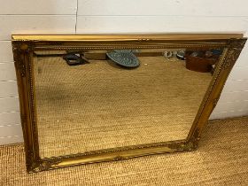 A gilt framed mirror 115cm x 92cm
