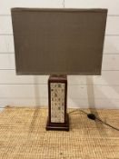 A table lamp with mahjong tiles to centre
