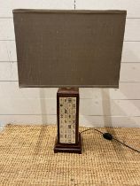 A table lamp with mahjong tiles to centre