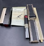 Two calculus instruments. An Otis King calculator and Unique log slide rule