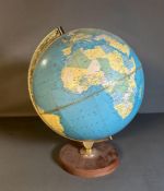 A vintage globe on wooden plinth