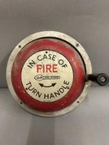 A vintage "in case of fire turn handle" fire alarm