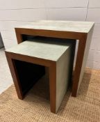 A nest of two Oka shagreen style gate side tables (H50cm W50cm D40cm)