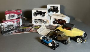 A selection of Diecast cars and motorbikes