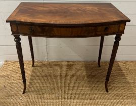 A Regency style mahogany side table on tapering out swept legs (H74cm W82cm D47cm)