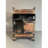 A Japanned jewellery box with drawers and cupboard opening to three small drawers 44.5cm H