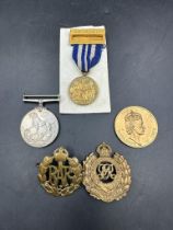 A selection of various medal and medallions to include 1939-45 medal, a Royal Society for the