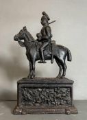 A cast iron doorstop of a military figure
