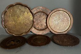 A selection of six Persian and Oriental brass and copper trays.