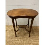 A kidney shaped side table on tapering out swept legs (H68cm W62cm D36cm)