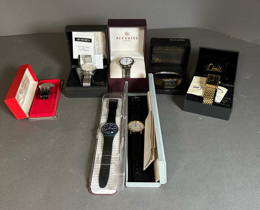A selection of seven boxed watches to include Swatch, Accurist, Limit etc.