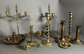 A selection of brass candleholders