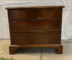 A flame mahogany two over three chests of drawers on bracket feet (H83cm W92cm D47cm)