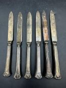 A set of six silver handled knives, hallmarked for Sheffield 1922 by William Yates.