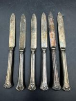 A set of six silver handled knives, hallmarked for Sheffield 1922 by William Yates.