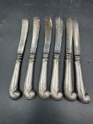 A set of six silver handled knives, hallmarked for Sheffield 1906 by Harrison Brothers & Howson