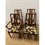 A set of four Mid Century Nathan dining chairs