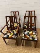 A set of four Mid Century Nathan dining chairs