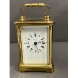 Asprey brass eight day carriage clock with key Condition Report in working order  side glass loose