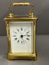 Asprey brass eight day carriage clock with key Condition Report in working order  side glass loose