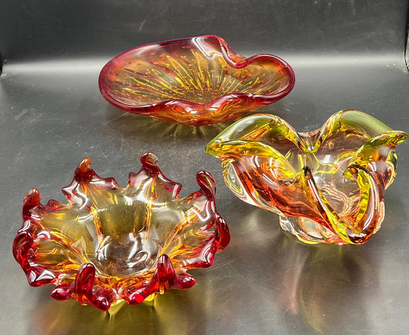 Three Murano and Czech Art glass pinch and twisted bowl fire reds and yellow (W26cm) Condition