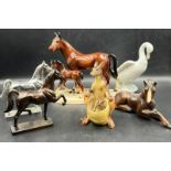 A collection of china animals including metal prancing horses and Beswick style horses