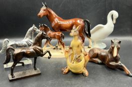 A collection of china animals including metal prancing horses and Beswick style horses