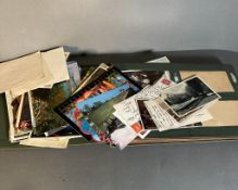 A vintage postcard album with a large quantity of post cards