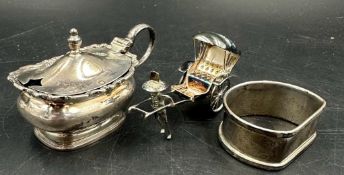A hallmarked silver napkin ring and cruet along with a sterling silver rickshaw.