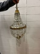 A small chandelier with brass fittings