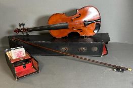 A violin and bow made in Saxony, case AF bow and violin in need of new strings and hair.