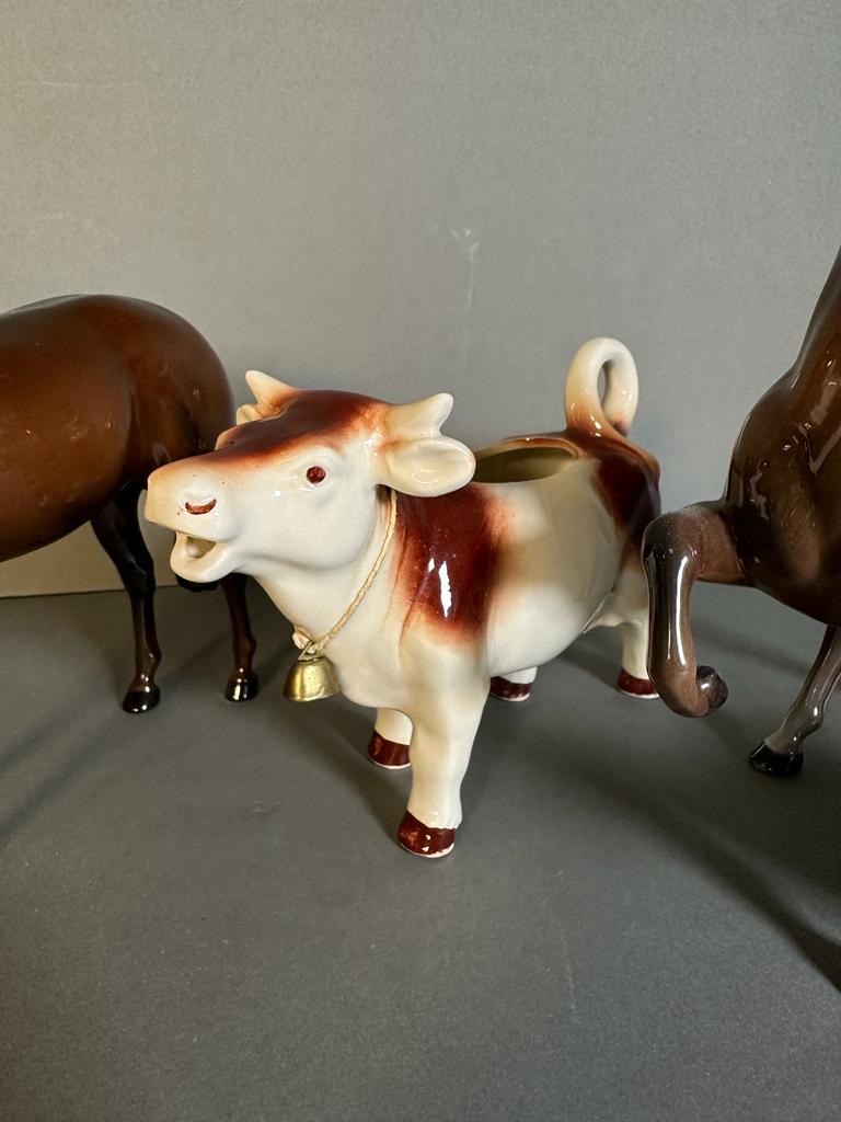 A selection of three Beswick figures and a cow creamer - Image 2 of 5