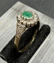 A 9ct gold ring with central emerald. Approximate Total weight 2.1g size N
