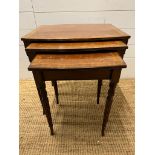 A set of nesting tables with string inlay and fluted legs (H51cm W50cm D38cm)